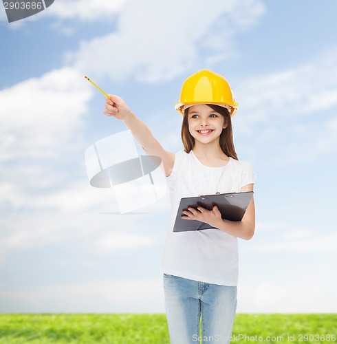 Image of smiling little girl in hardhat with clipboard