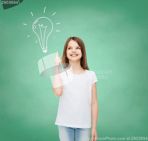 Image of smiling little girl in white blank t-shirt