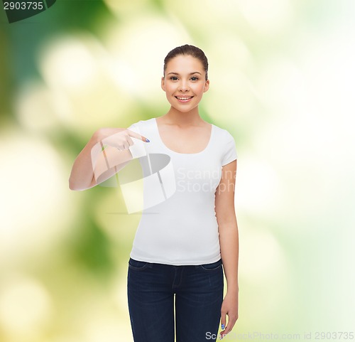 Image of smiling young woman in blank white t-shirt