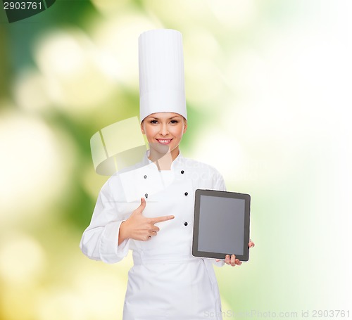 Image of smiling female chef with tablet pc blank screen