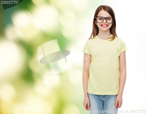 Image of smiling cute little girl in black eyeglasses