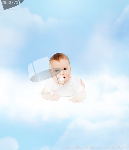 Image of smiling baby lying on cloud with dummy in mouth