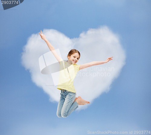 Image of smiling little girl jumping