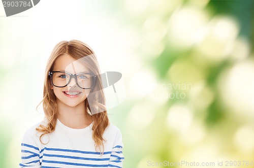 Image of smiling cute little girl with black eyeglasses