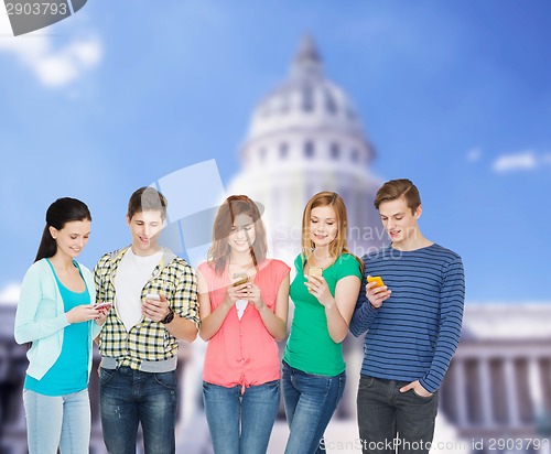 Image of smiling students with smartphones