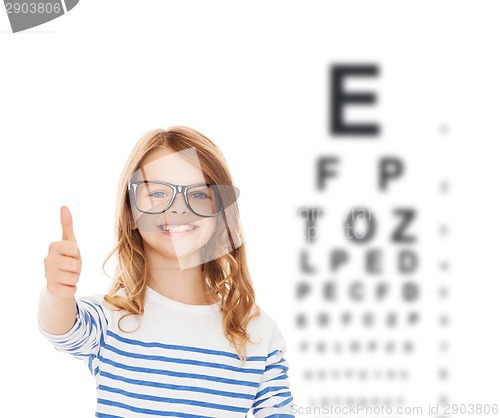 Image of little girl with black eyeglasses