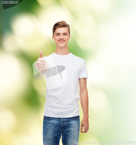 Image of smiling man in white t-shirt showing thumbs up