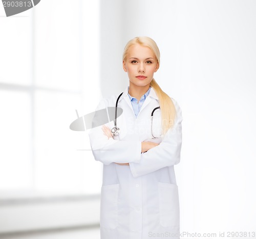 Image of serious female doctor with stethoscope