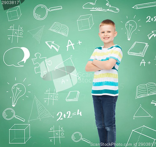 Image of little boy in casual clothes with arms crossed