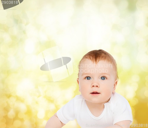 Image of smiling baby looking up