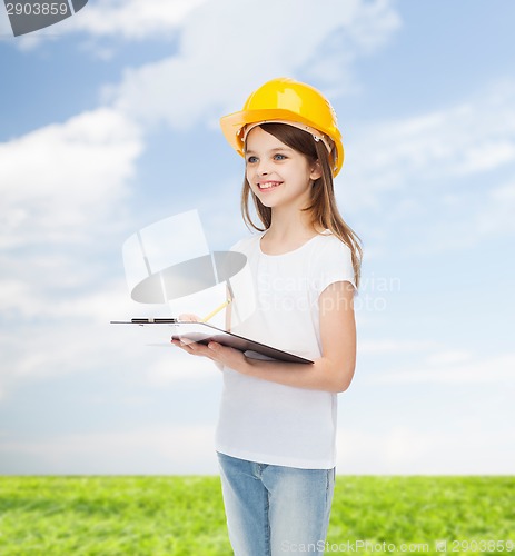 Image of smiling little girl in hardhat with clipboard