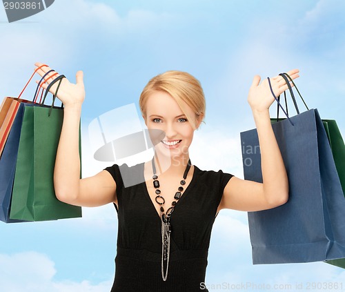 Image of lovely woman with shopping bags