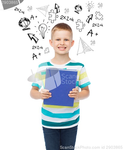 Image of smiling little student boy with blue book