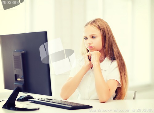 Image of student girl with computer at school