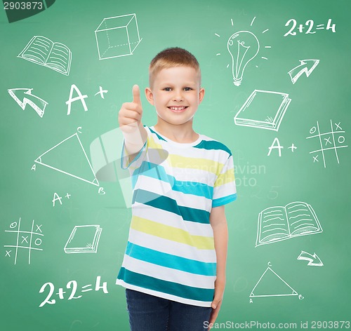 Image of little boy in casual clothes with arms crossed