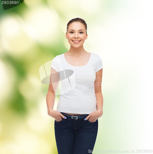Image of smiling young woman in blank white t-shirt