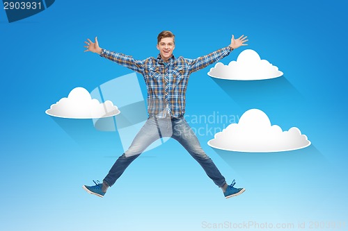 Image of smiling young man jumping in air