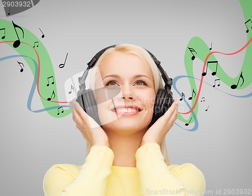 Image of smiling young woman with headphones