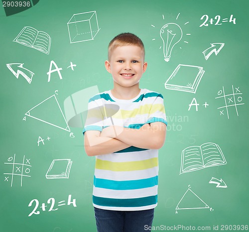 Image of little boy in casual clothes with arms crossed