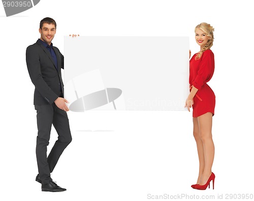 Image of couple holding big blank white board