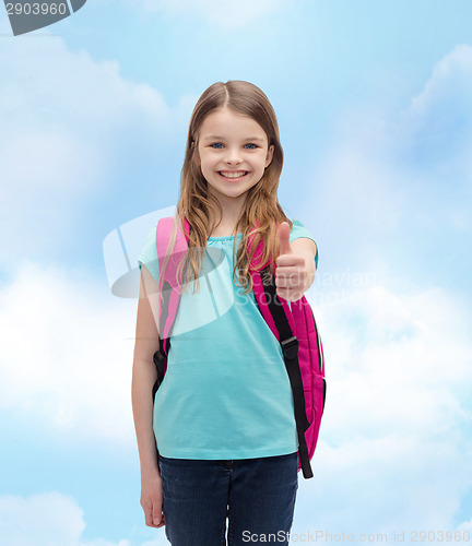 Image of smiling girl with school bag showing thumbs up