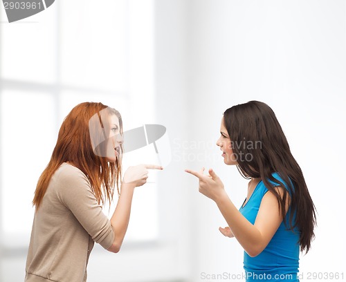 Image of two teenagers having a fight