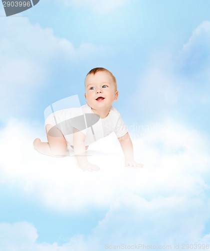 Image of crawling smiling baby looking up