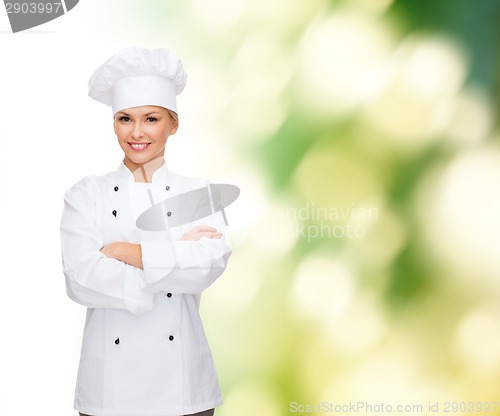 Image of smiling female chef with crossed arms