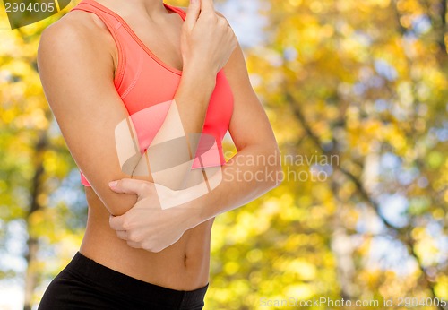 Image of sporty woman with pain in elbow