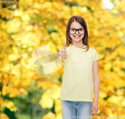 Image of smiling cute little girl in black eyeglasses