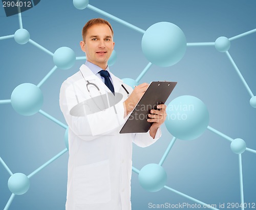 Image of smiling male doctor with clipboard and stethoscope