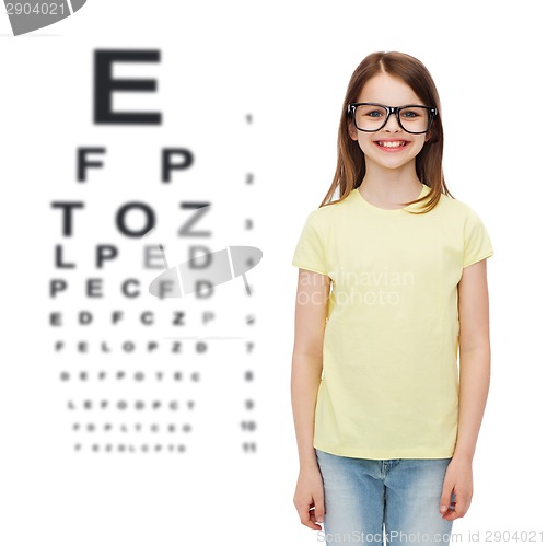 Image of smiling cute little girl in black eyeglasses