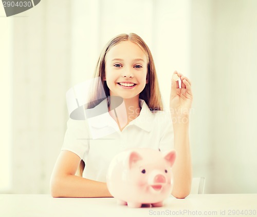 Image of child with piggy bank