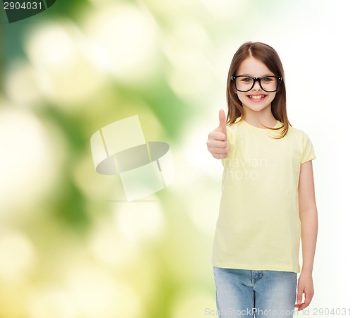 Image of smiling cute little girl in black eyeglasses