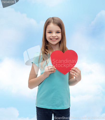 Image of smiling little girl with red heart