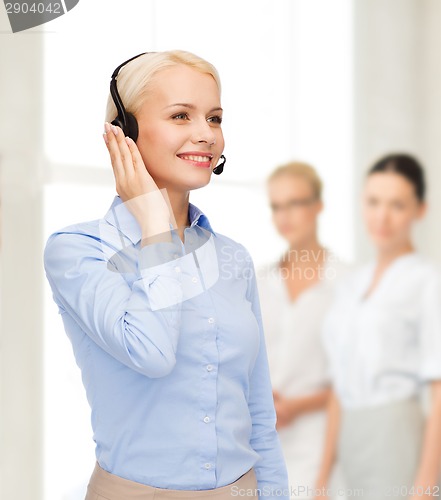 Image of friendly female helpline operator
