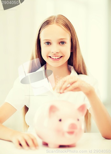 Image of child with piggy bank