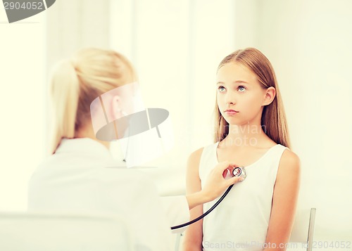 Image of doctor with stethoscope listening to the patient