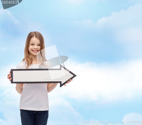 Image of smiling girl with blank arrow pointing right