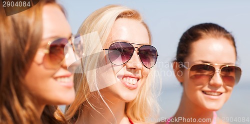 Image of close up of smiling young women in sunglasses