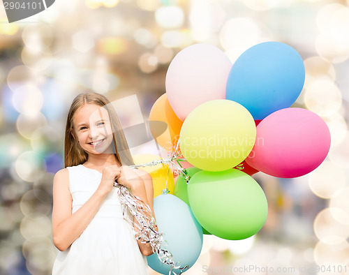 Image of happy girl with colorful balloons