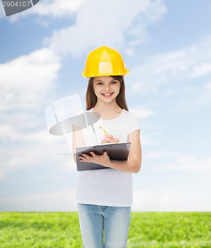 Image of smiling little girl in hardhat with clipboard