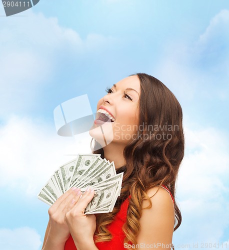 Image of woman in red dress with us dollar money