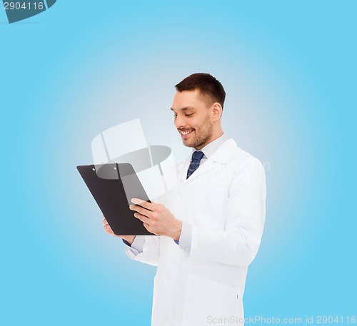 Image of smiling male doctor with clipboard