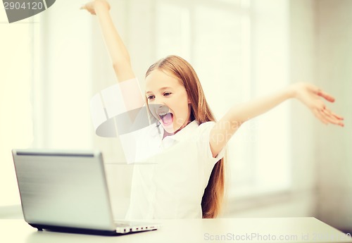 Image of girl with laptop pc at school