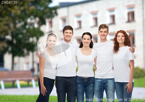 Image of group of smiling teenagers in white blank t-shirts