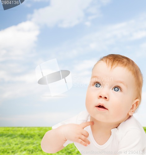 Image of curious baby looking up