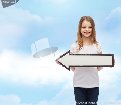 Image of smiling girl with blank arrow pointing left