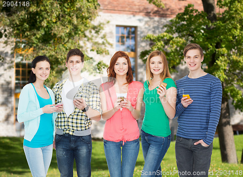 Image of smiling students with smartphones