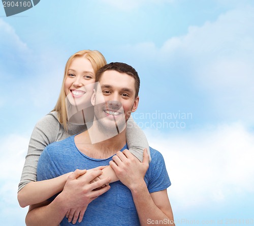 Image of smiling couple hugging